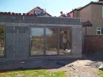 Mr & Mrs B. - Helsby, Cheshire : Installtion of Alstyle Marine Finish Alumnium Bi Fold doors Triple glazed with 44mm sealed units. Flush Floor track. Hydrolic magnetic closures Example of aluminium triple glazed bi-fold doors. Aluminium bi-fold doors near Macclesfield SK11. Alumnus doors with 44mm triple glazing near Alderly Edge SK9. Aluminium Bi-fold doors near Wirral CH48 CH60. Alumnus Bi-fold doors triple glazed Liverpool Formby L37 near South Port PR8 Bi-fold doors near Crosby L23